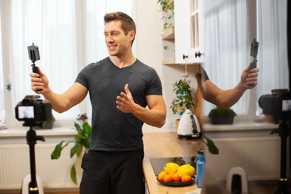 Fitness coach recording nutrition video for online clients in kitchen