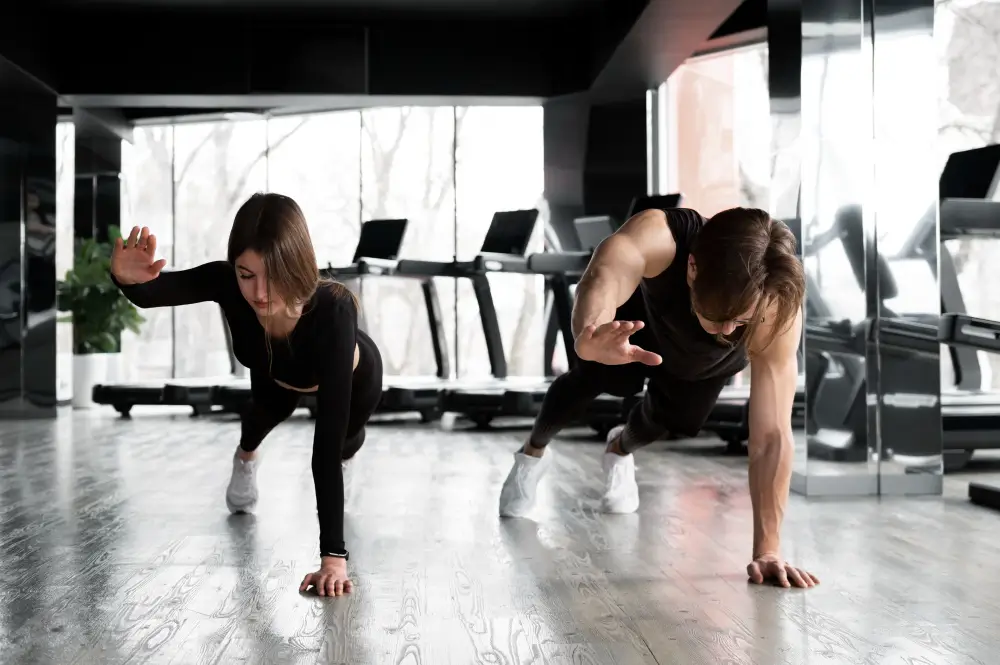 People training together in boutique fitness studio, yoga and pilates style workout