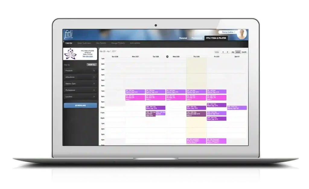 Fitli scheduling dashboard displayed on laptop screen with class calendar view.